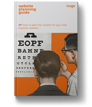 front cover of a book showing two men reading an eye chart