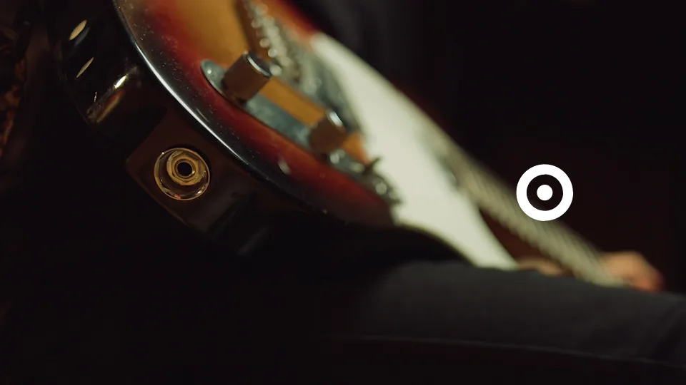 Guitar being plugged in