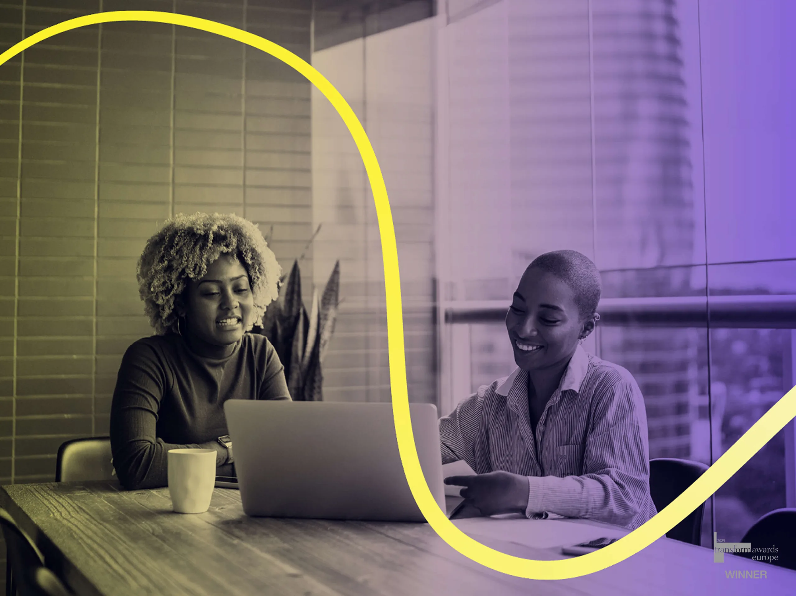 Two women talking in an office room