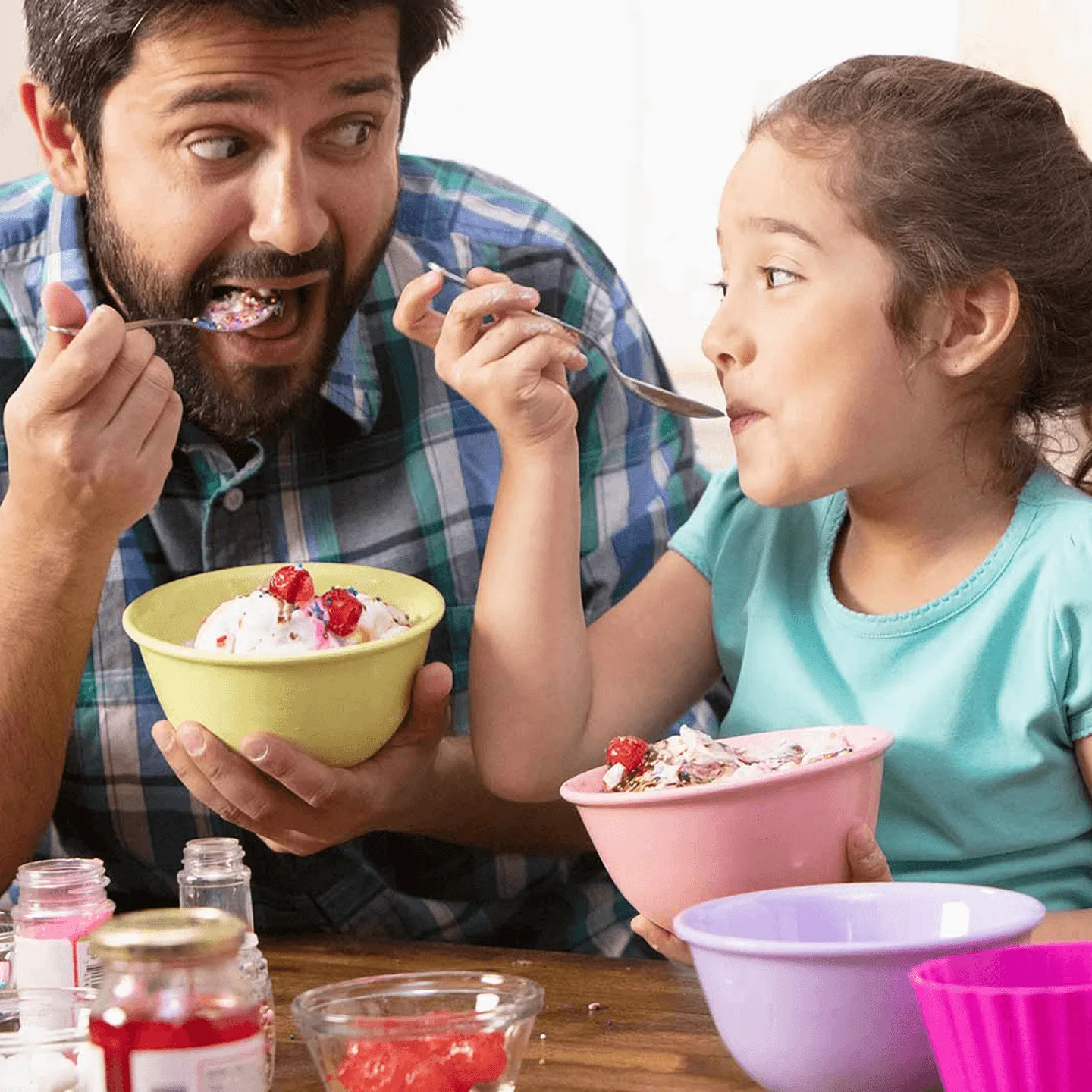Parent and child eating ice cream.
